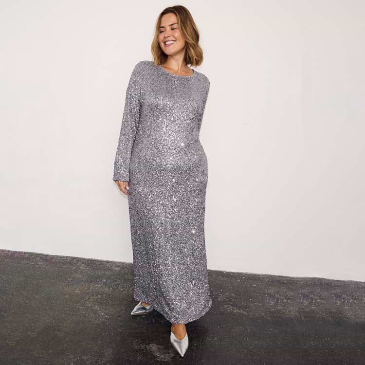 Gunmetal Sequin Soho Dress with long sleeves and a body-skimming maxi silhouette in shimmering grey sequins.
