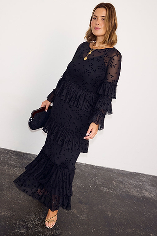 Black Star Devore Felicity Dress with tiered ruffles and velvet star motifs, shown on a curve model.