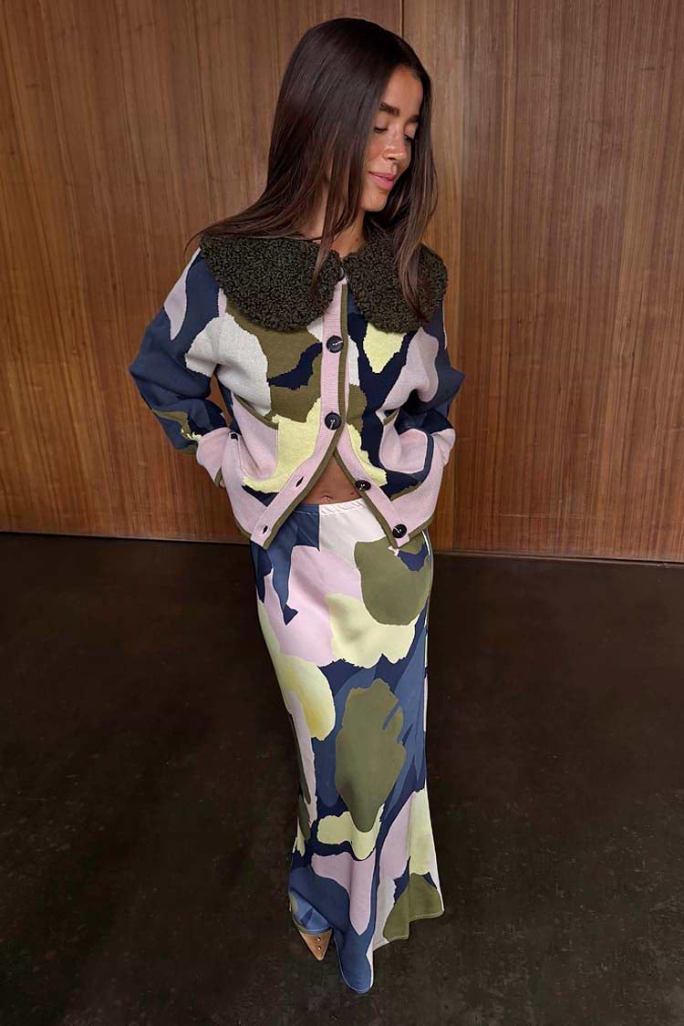 Teal Mara Abstract Dorris Midi Skirt in a neutral-toned print, styled as a transeasonal co-ord with a matching cardigan.