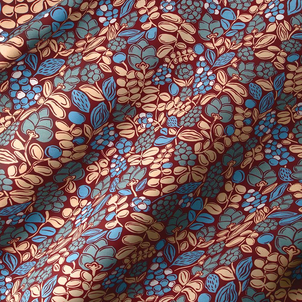 Floral fabric pattern with large blue and purple flowers