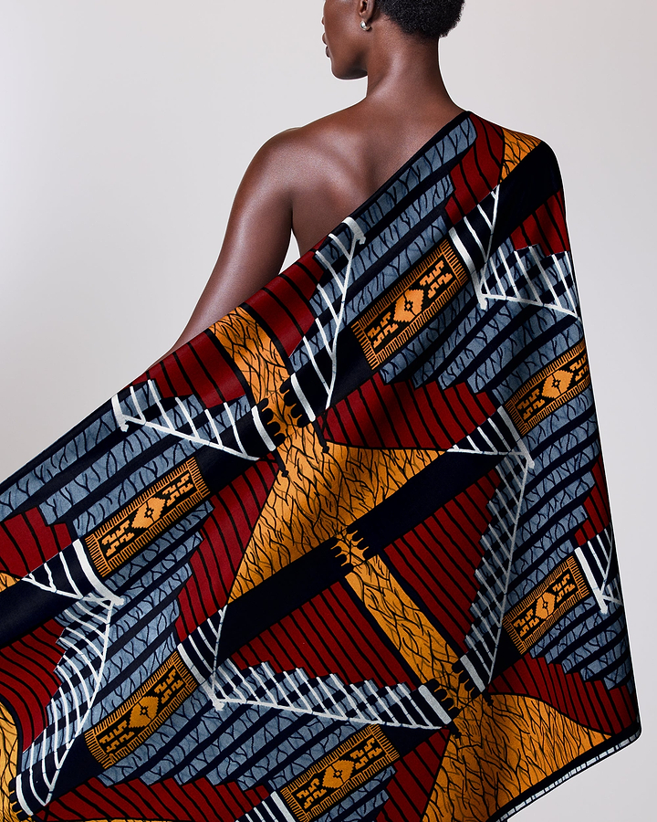 Colorful patterned fabric draped person wax hollandais vl00024.062