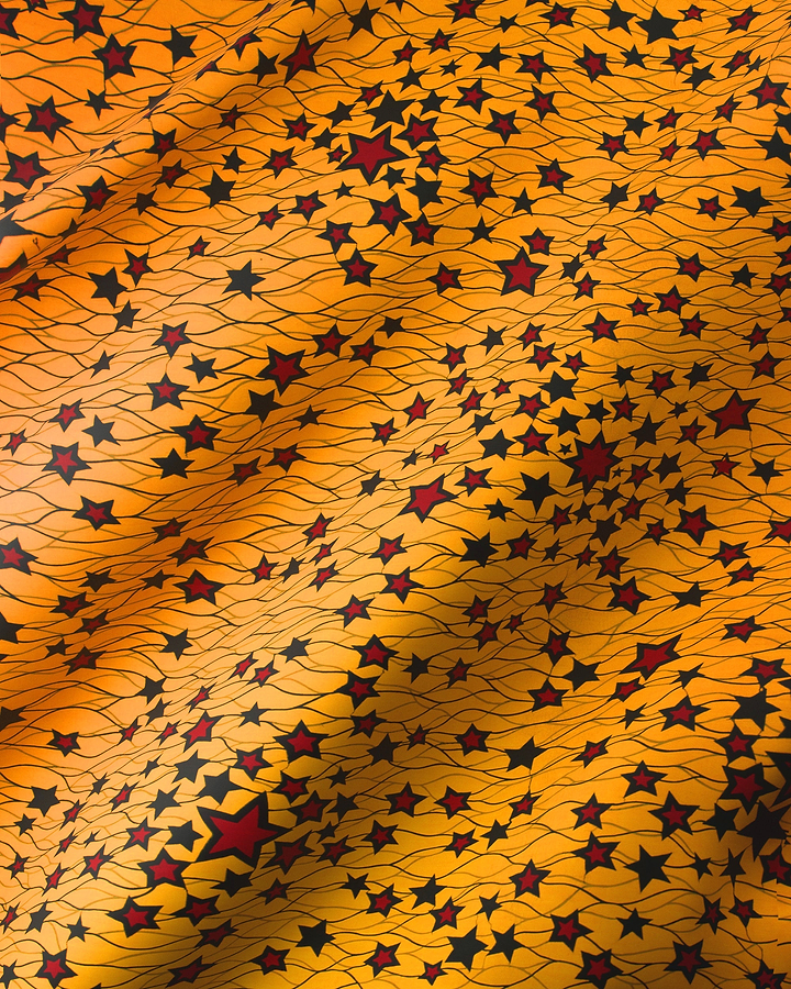 Vibrant orange fabric adorned lively wax hollandais vl00954.138