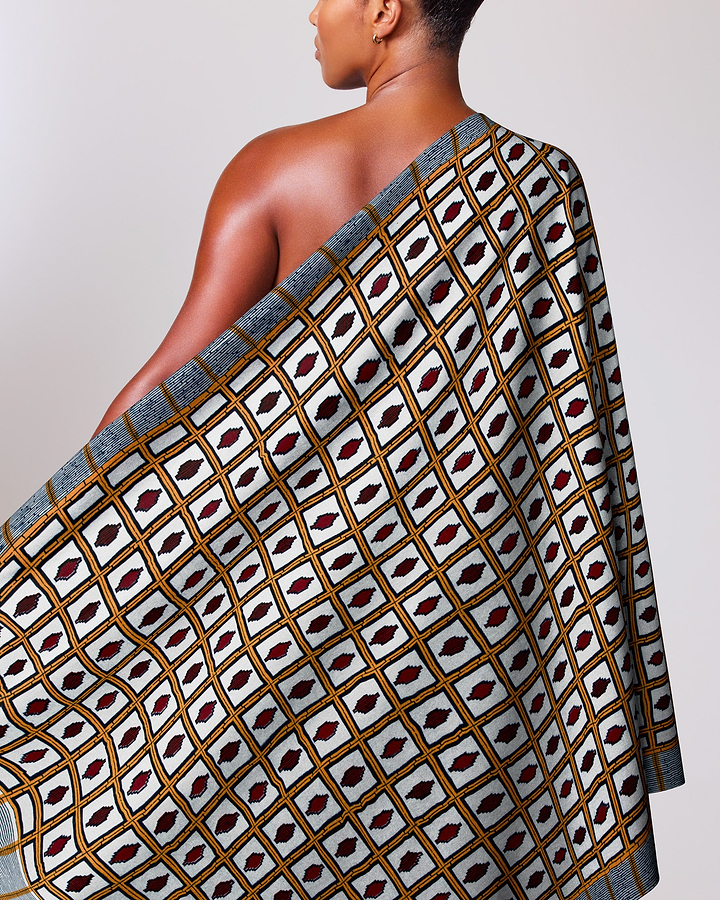 Woman wears one-shoulder wrap dress wax hollandais vl01630.027