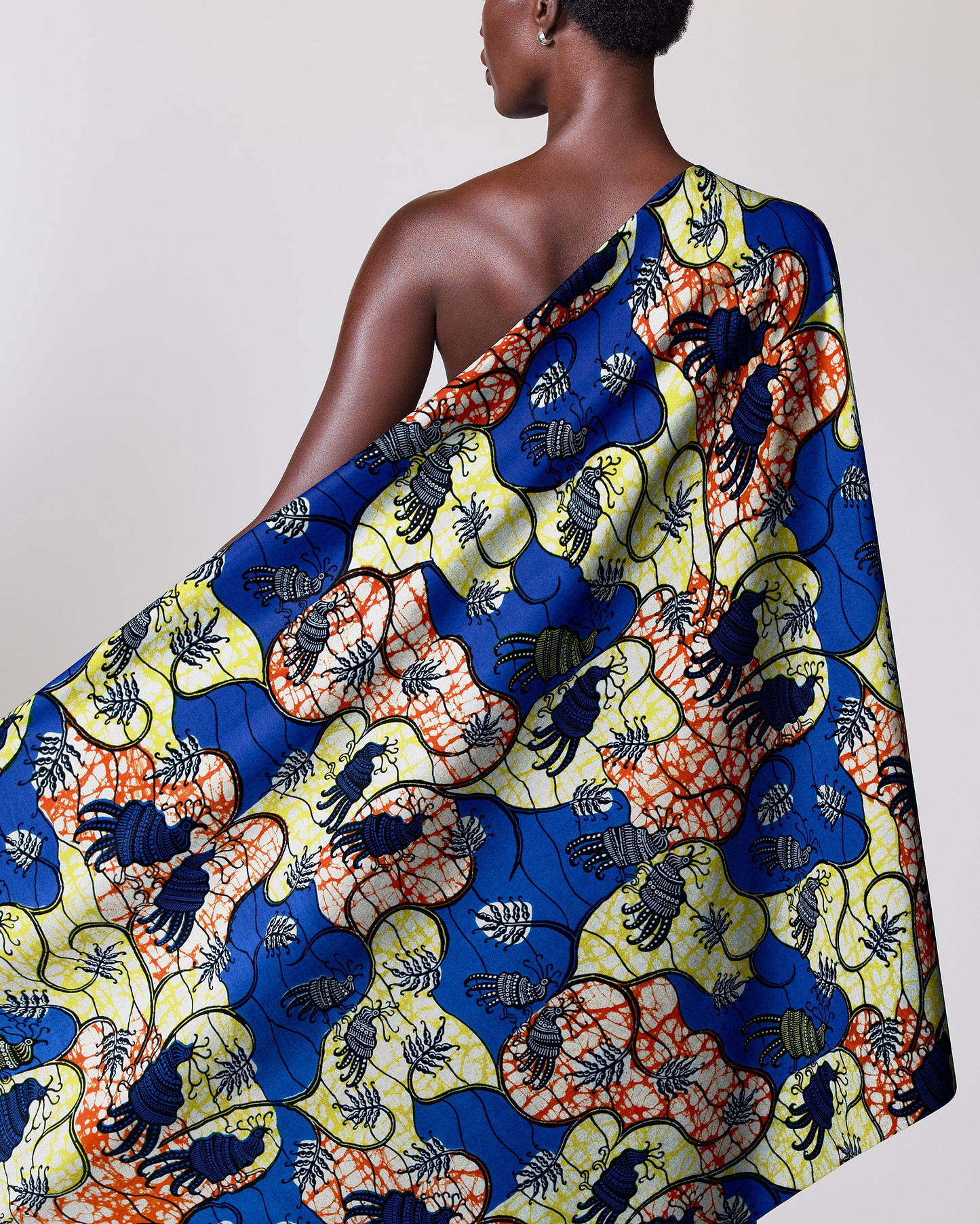 Colorful patterned fabric draped person’s super-wax vl02919.091
