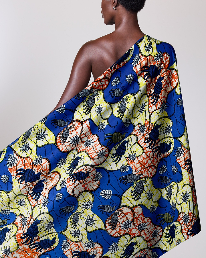 Colorful patterned fabric draped person’s super-wax vl02919.091