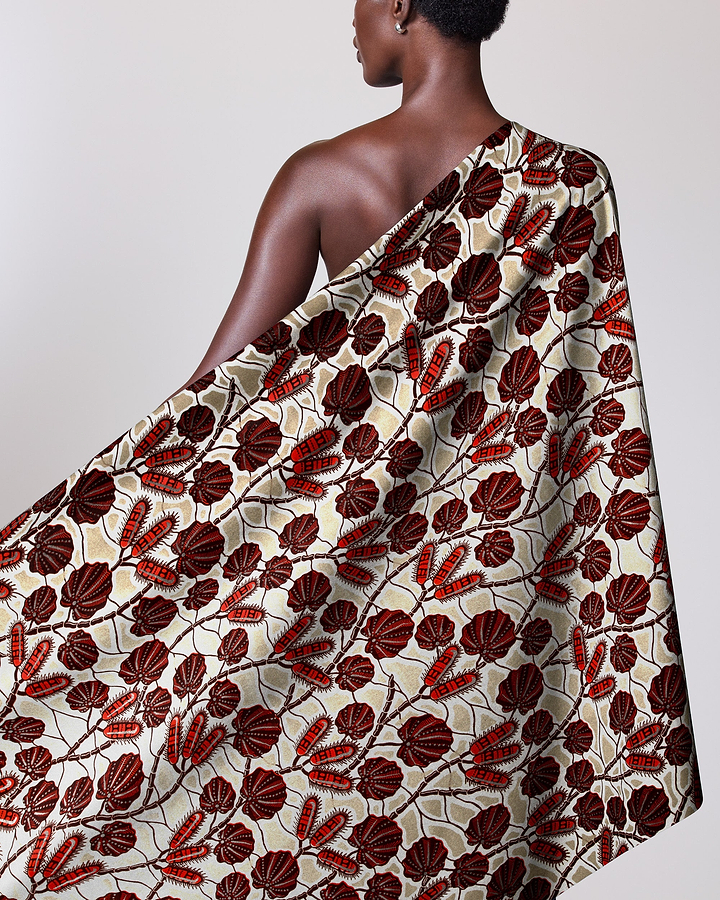 Woman wears one-shoulder garment made wax glitterglam vl03004.012