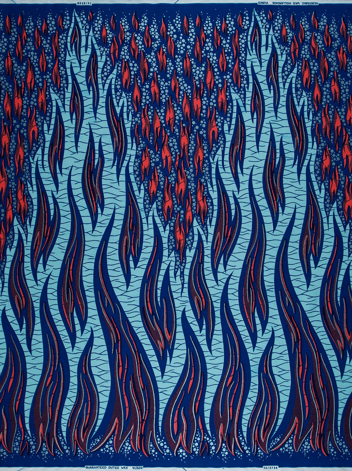 Flame-patterned Wax Hollandais fabric in pastel blue, ideal for vibrant African fabric designs
