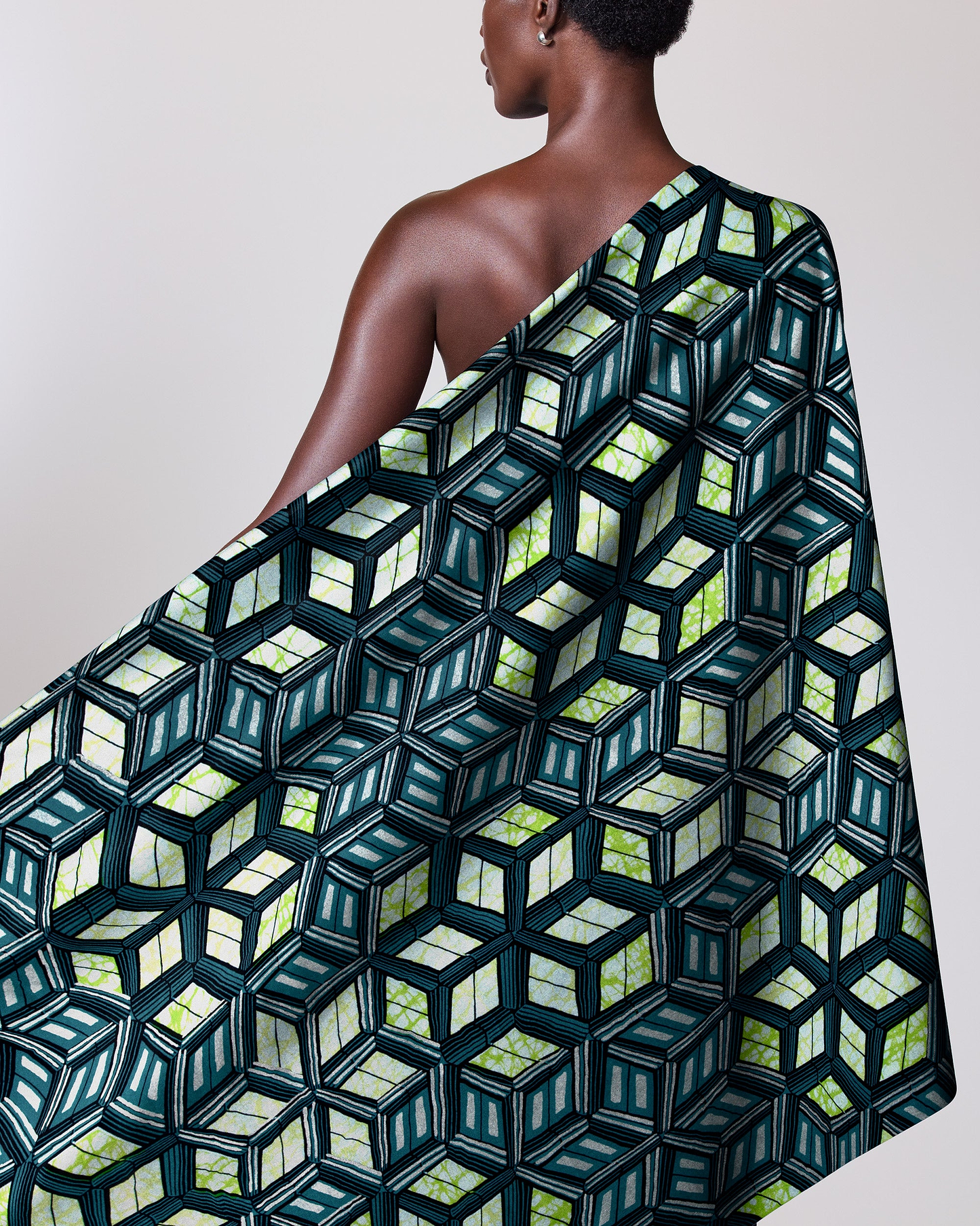 Woman wears one-shoulder wrap dress super-wax vl04767.012