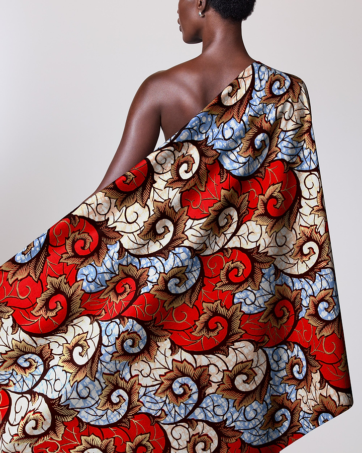Woman draped colorful patterned fabric super-wax vl04860.023