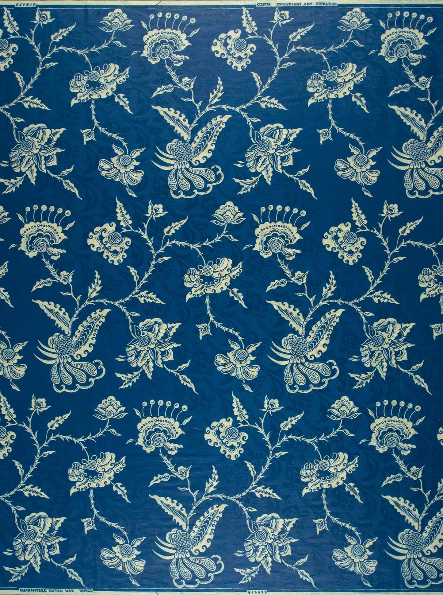 Deep blue fabric adorned intricate wax hollandais vl08473.009