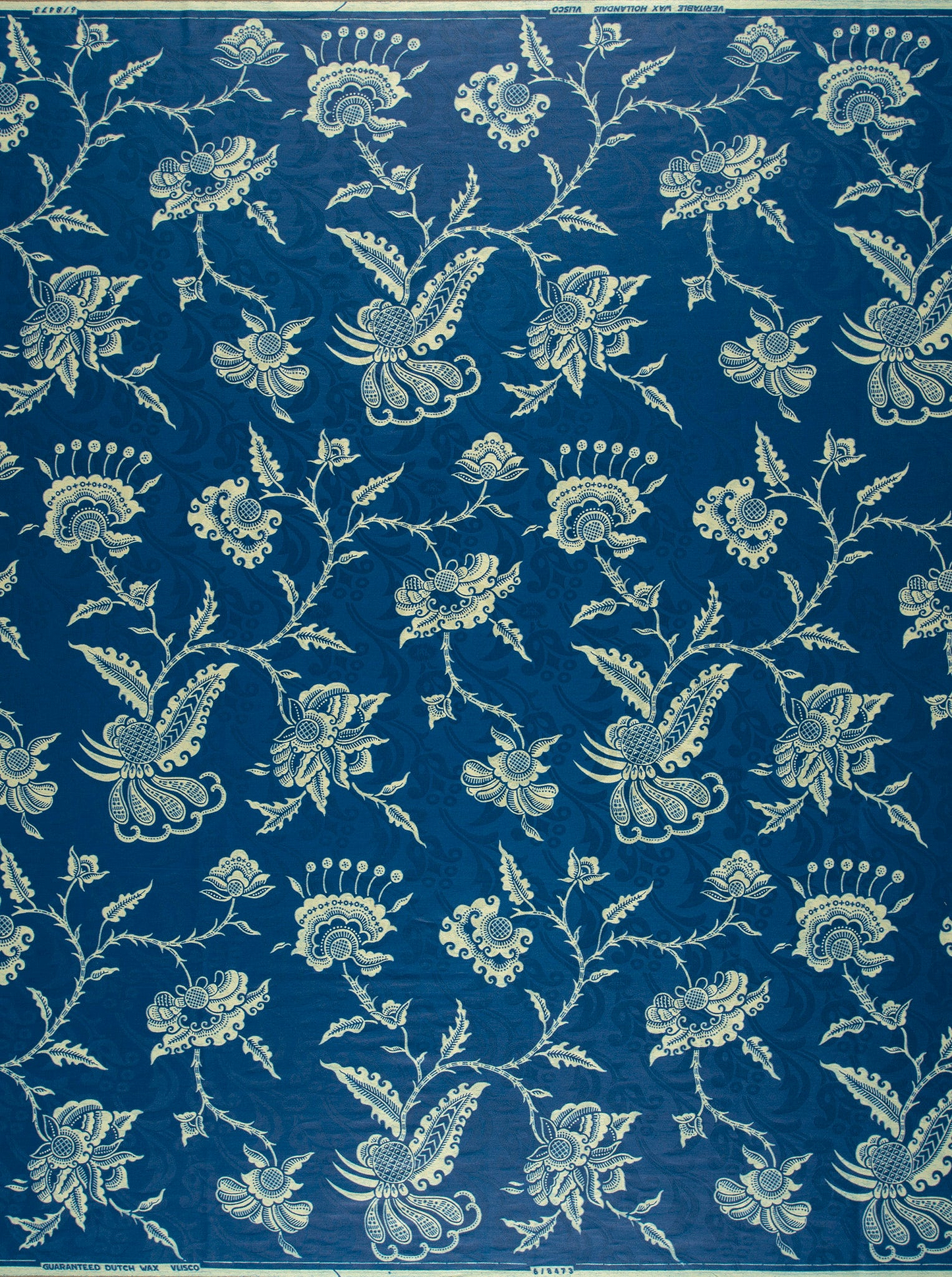 Deep blue fabric adorned intricate wax hollandais vl08473.009