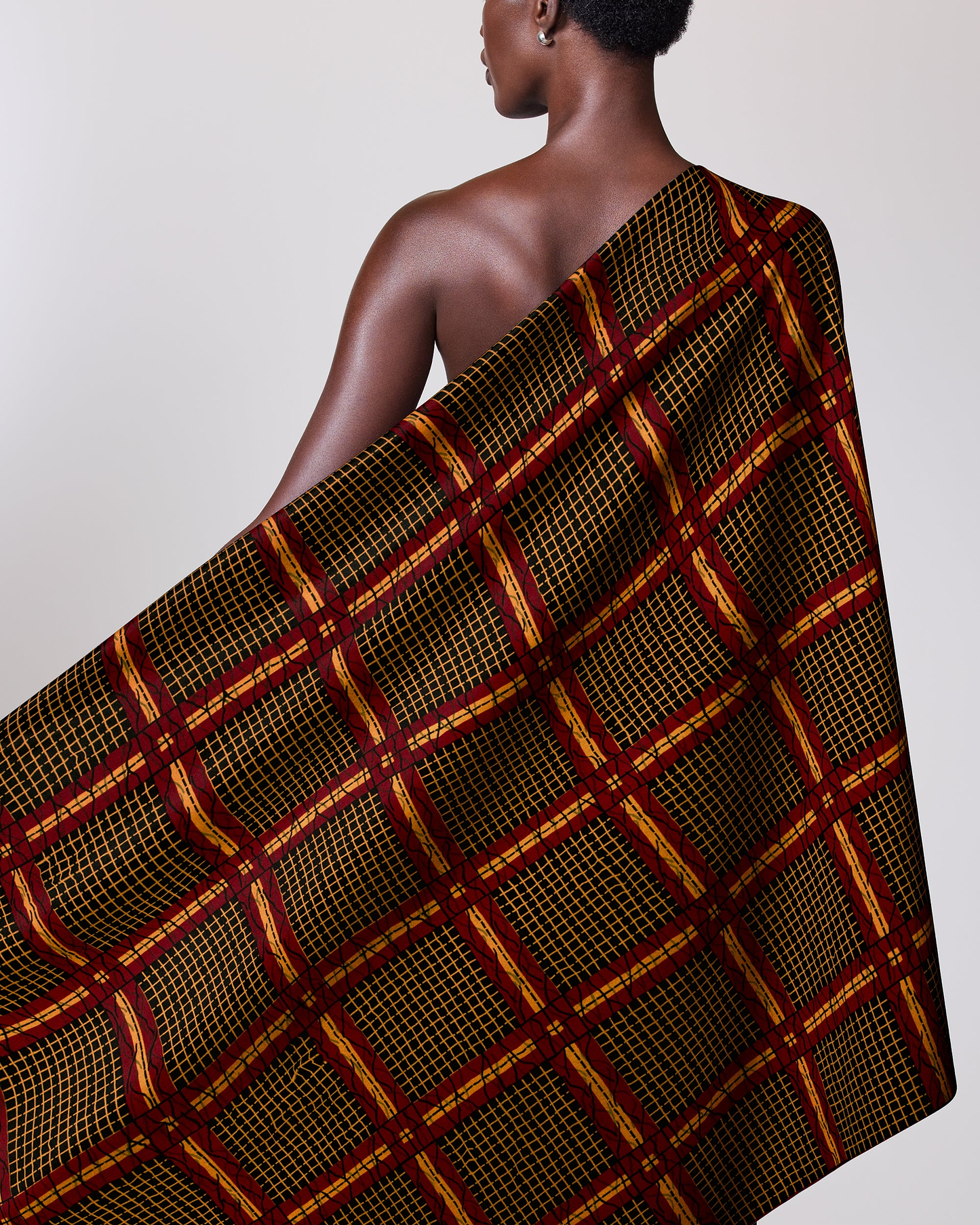 Dark-skinned woman draped patterned cloth wax hollandais vl49150.057