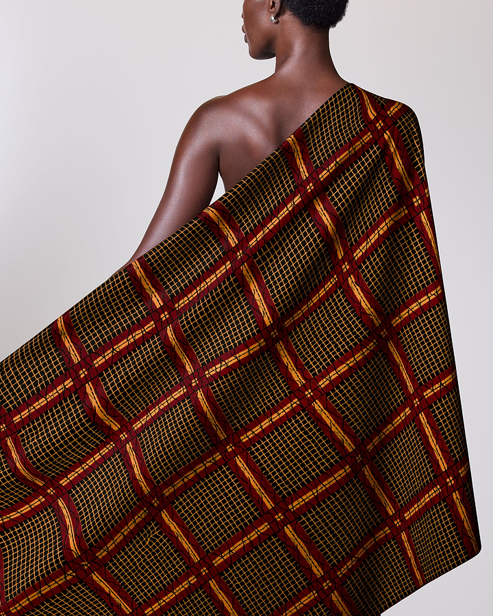 Dark-skinned woman draped patterned cloth wax hollandais vl49150.057