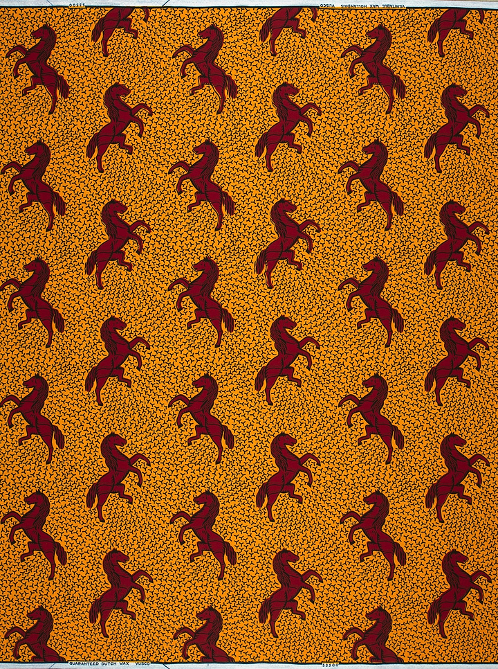 Orange fabric burgundy horse pattern wax hollandais vl53500.112