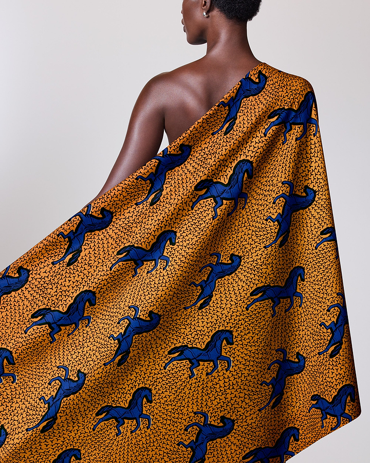 Vibrant orange fabric draped model’s wax hollandais vl53500.113