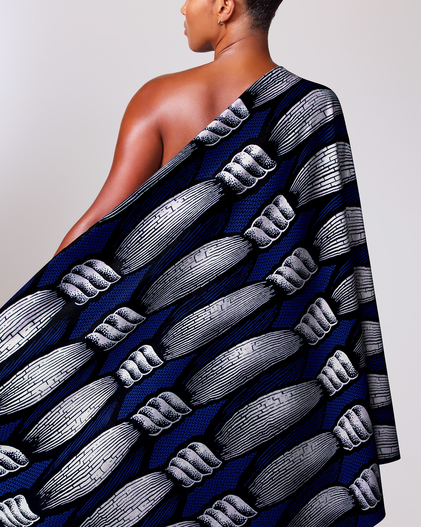 Woman wears navy blue one-shoulder wax hollandais vla0840.012