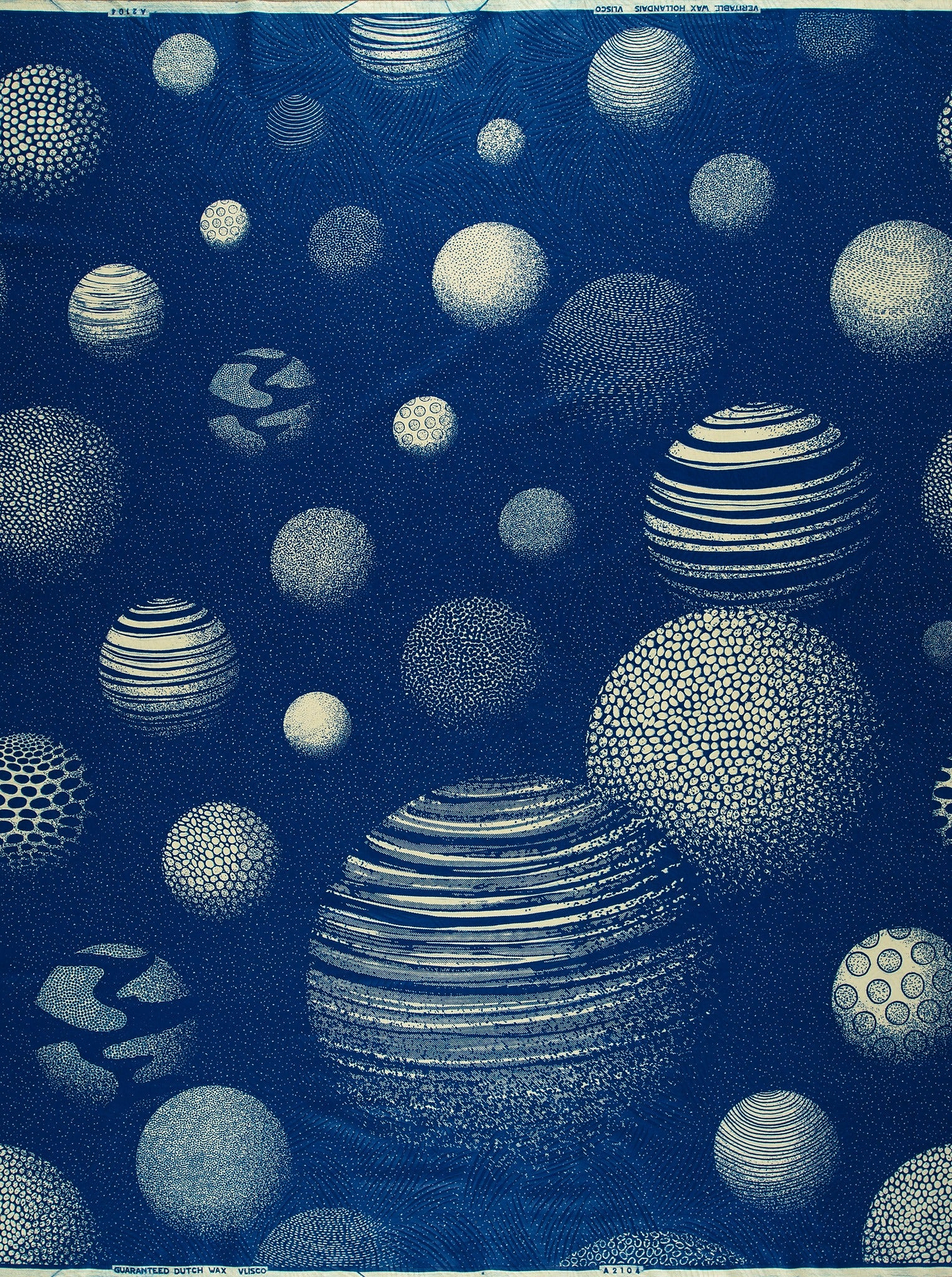 Cyanotype-printed spherical pattern on Wax Hollandais fabric, ideal for African fabric designs