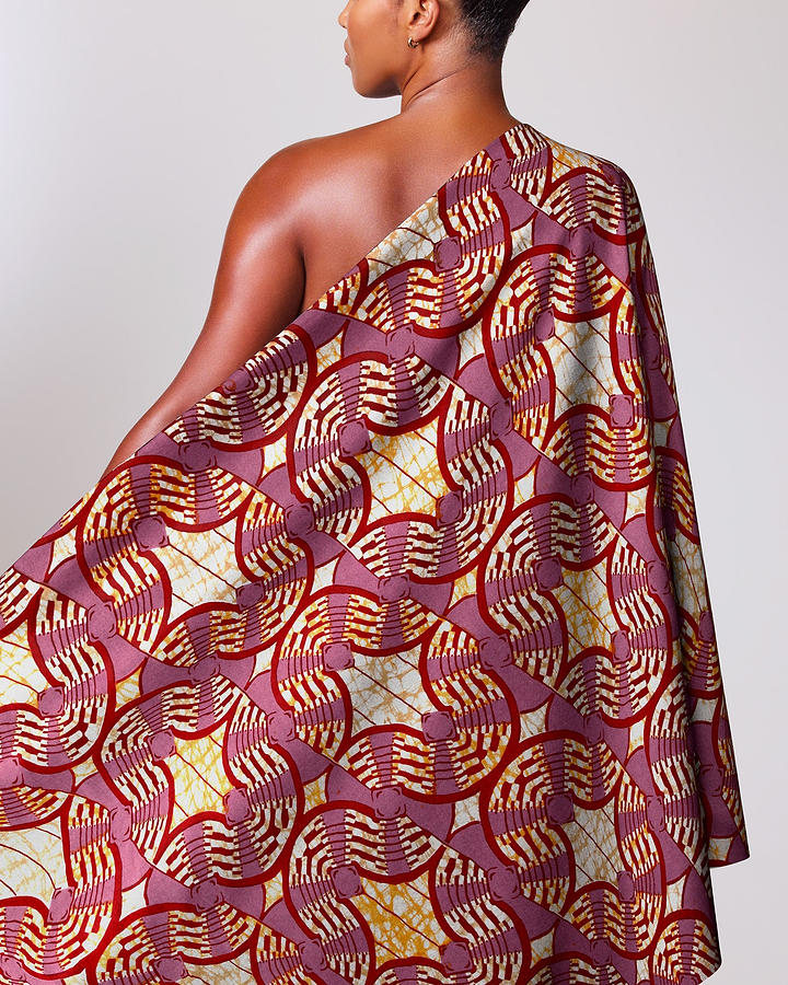 Woman wears one-shoulder dress made super-wax vls0476.008