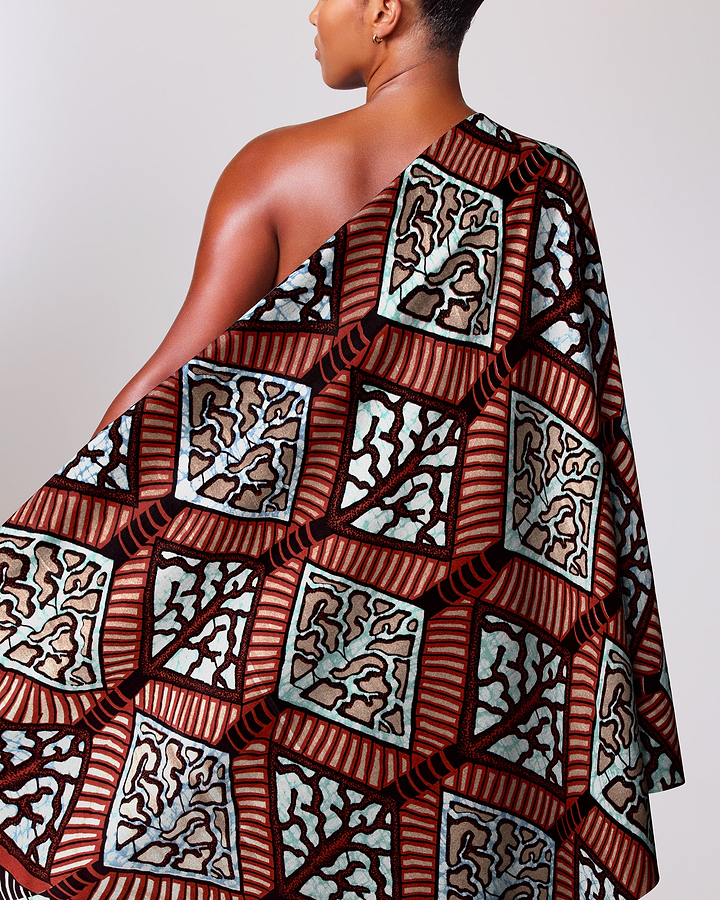 Woman wears one-shoulder dress made super-wax vls4398.009