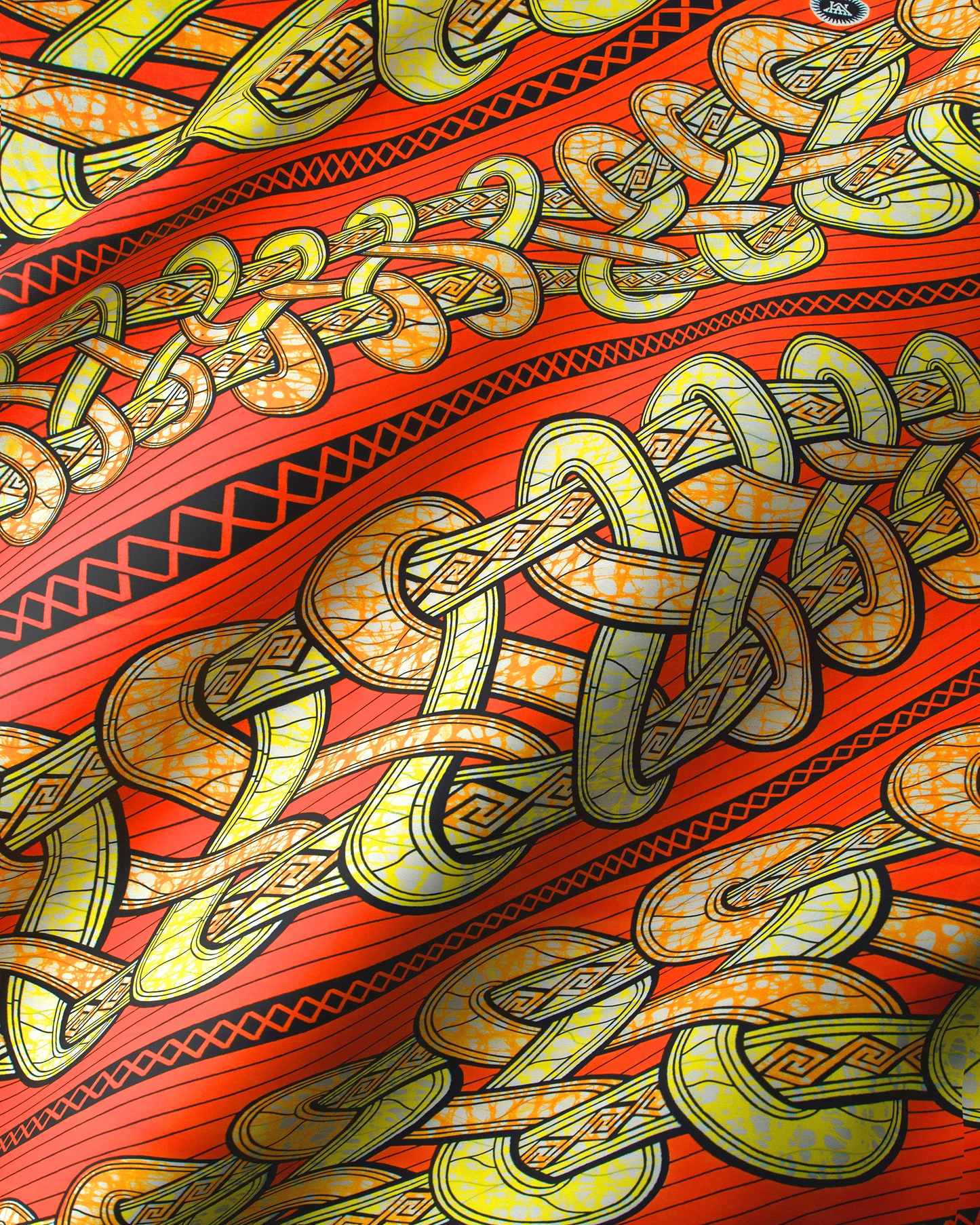 Vibrant red fabric intricate yellow super-wax vls4959.012