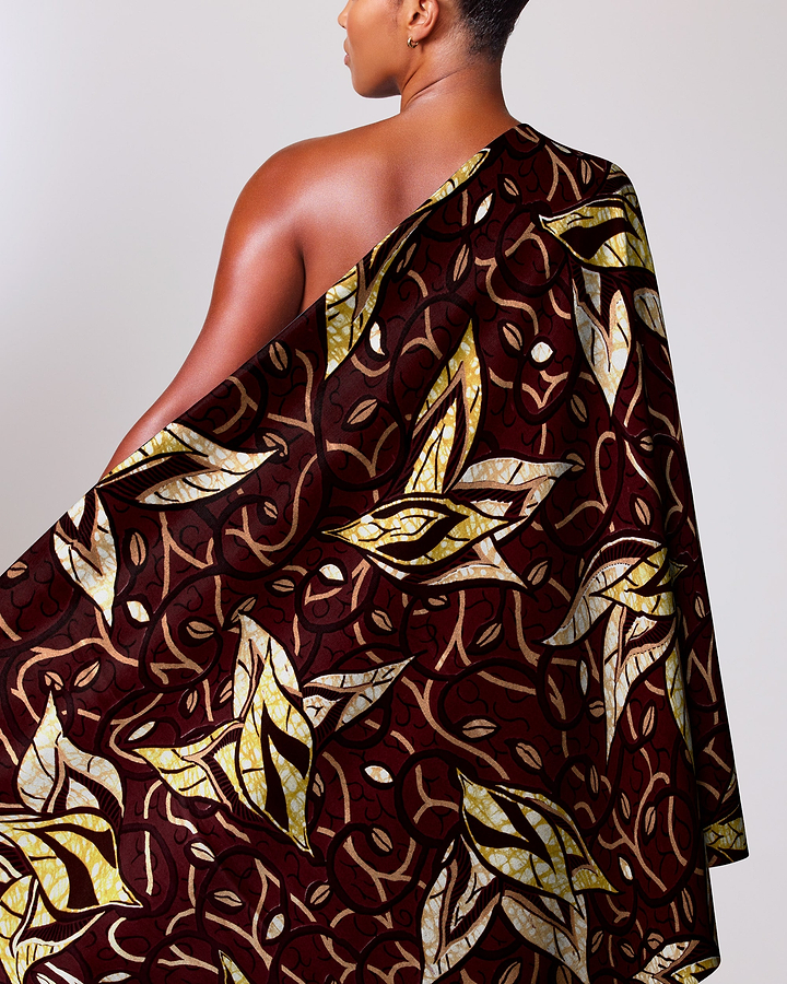 Woman wears one-shoulder garment made super-wax vls7382.009