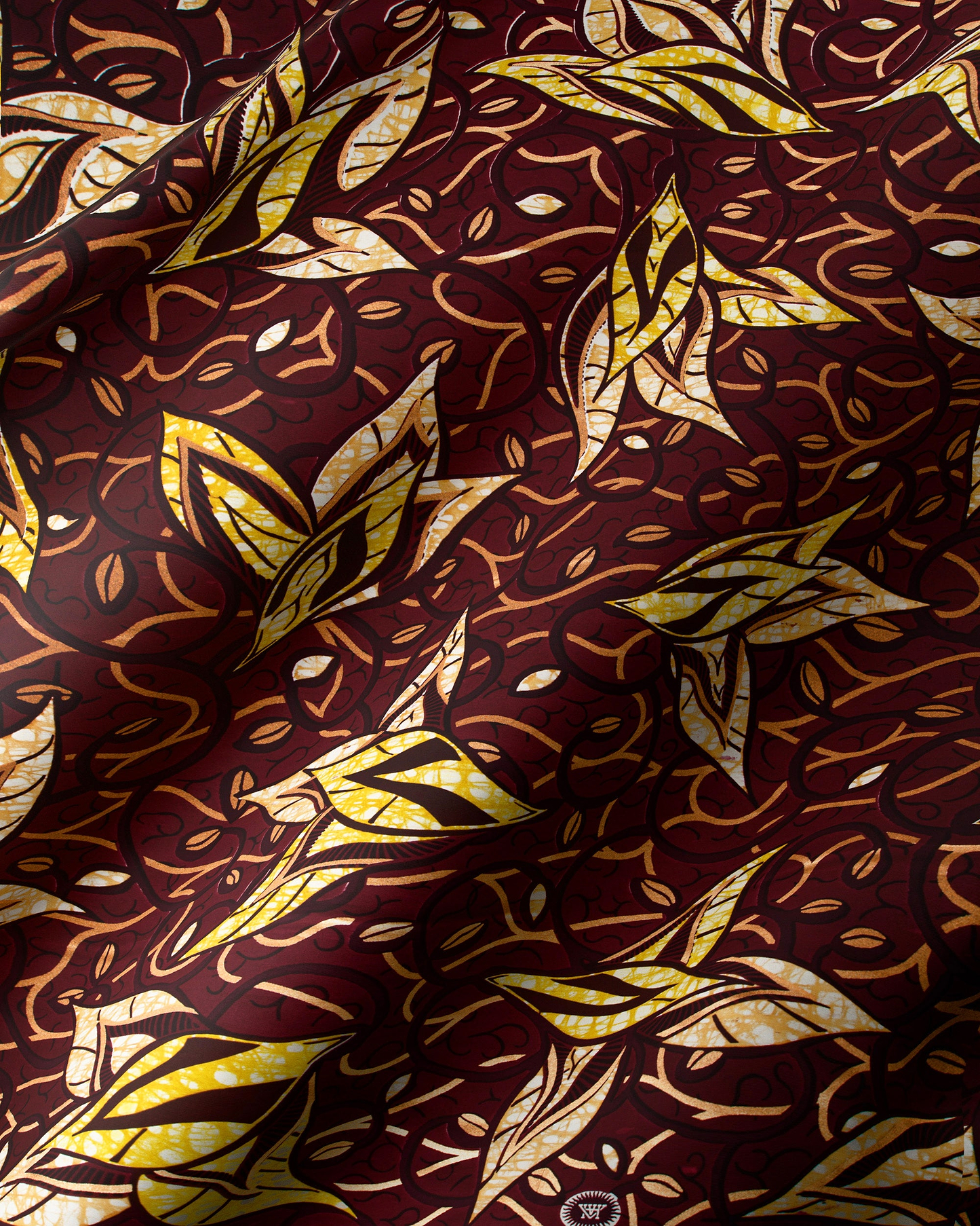 Rich maroon fabric adorned intricate super-wax vls7382.009