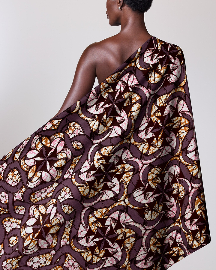 Woman wears one-shoulder garment made super-wax vls8270.008