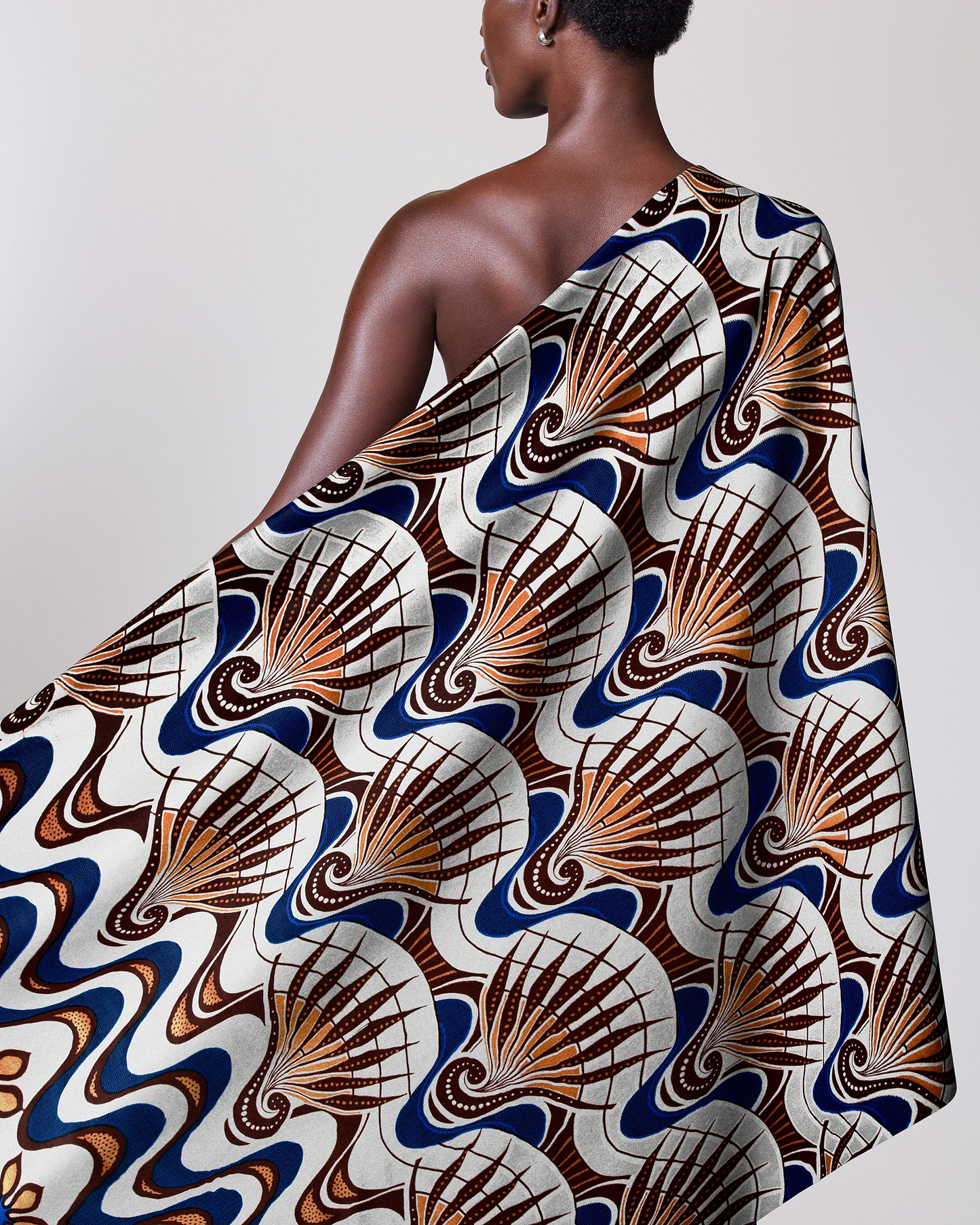 Woman wears one-shoulder garment made wax glitterglam vlw6801.023