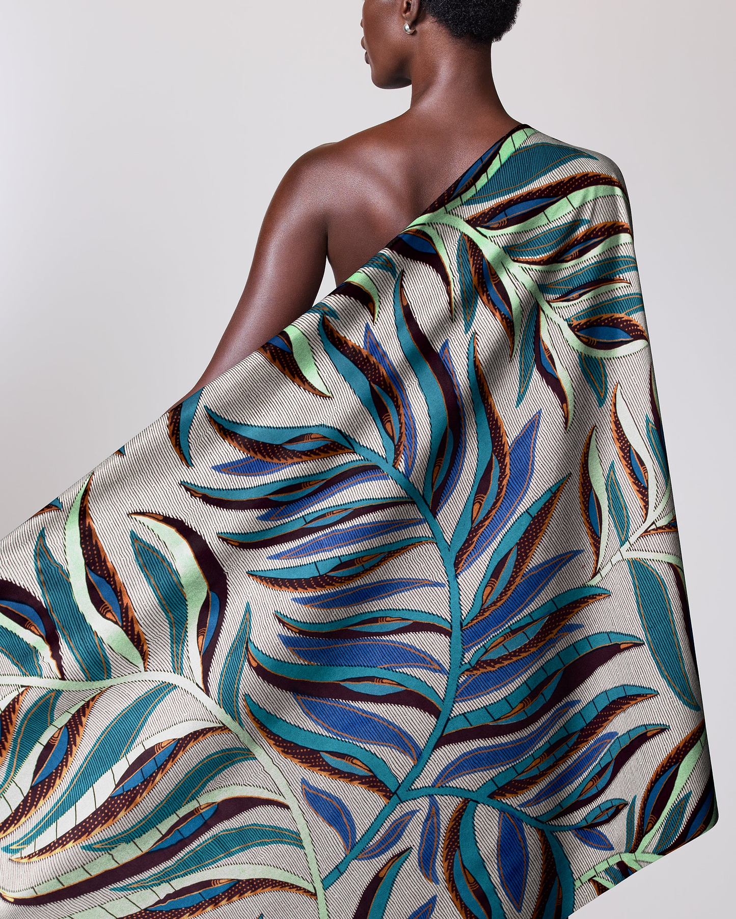 Woman wears one-shoulder wrap dress satin royal vlw7906.004