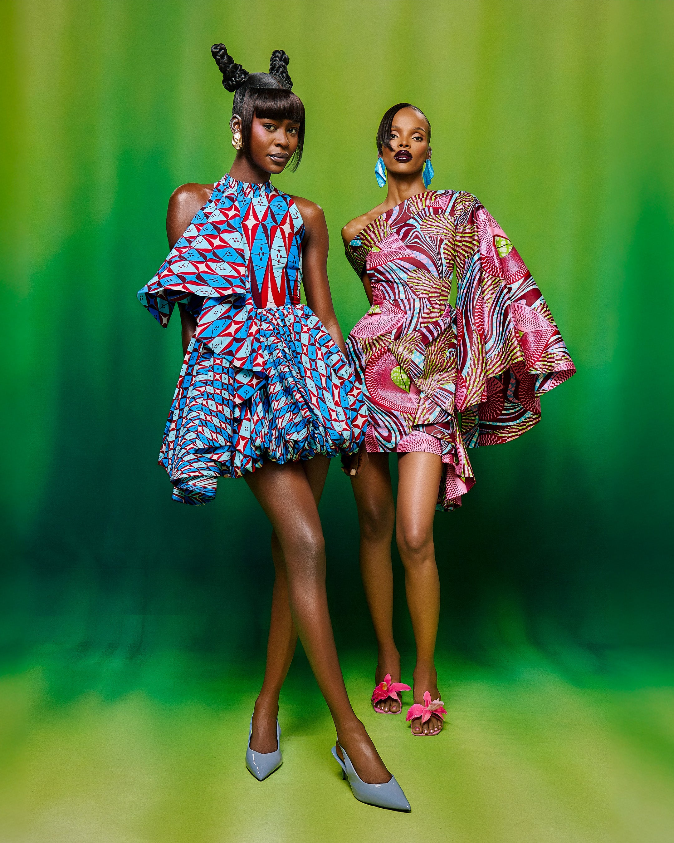 Two models wear vibrant asymmetrical grand super-wax vls6997.001