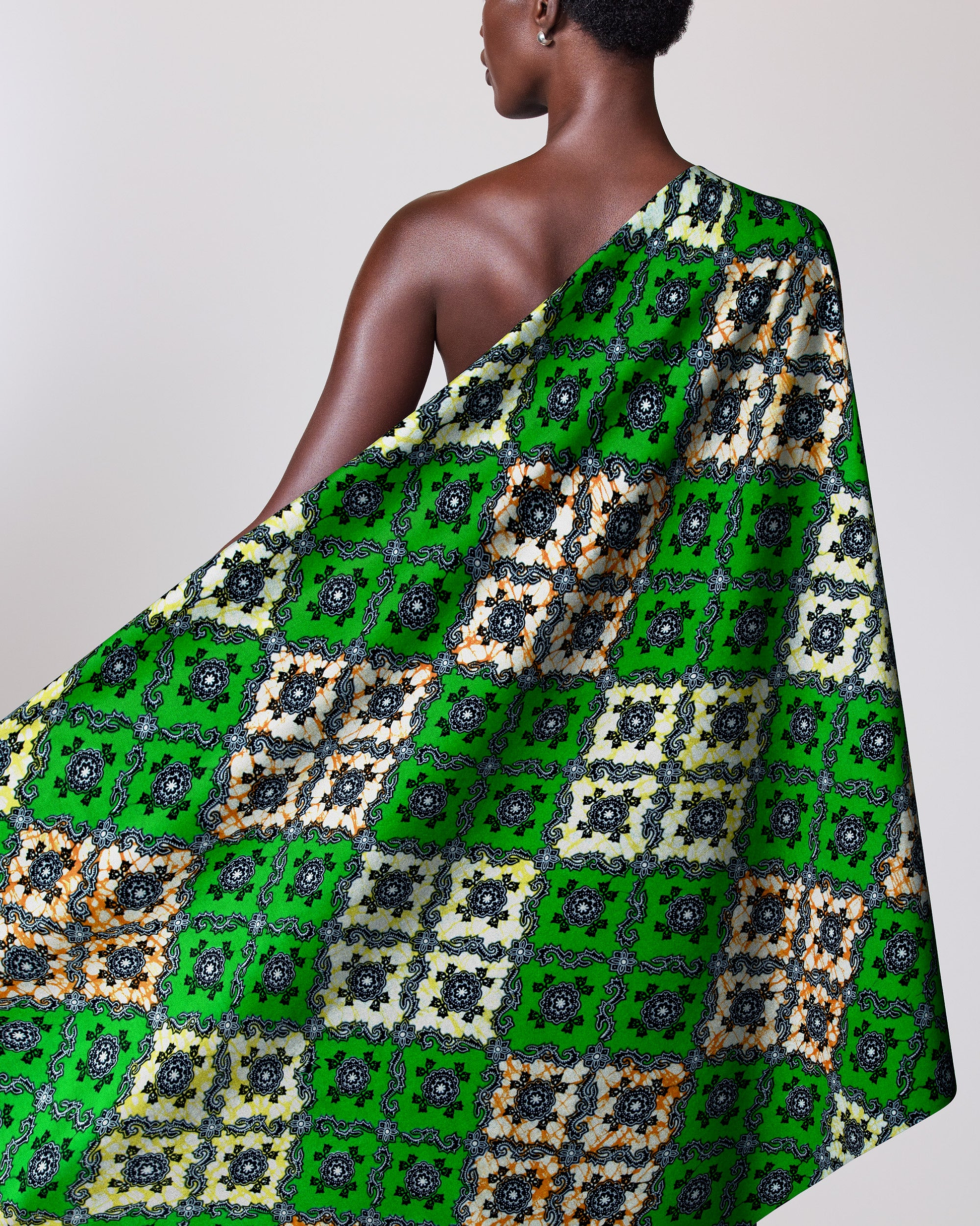 Green patterned fabric draped person’s super-wax vl02789.228