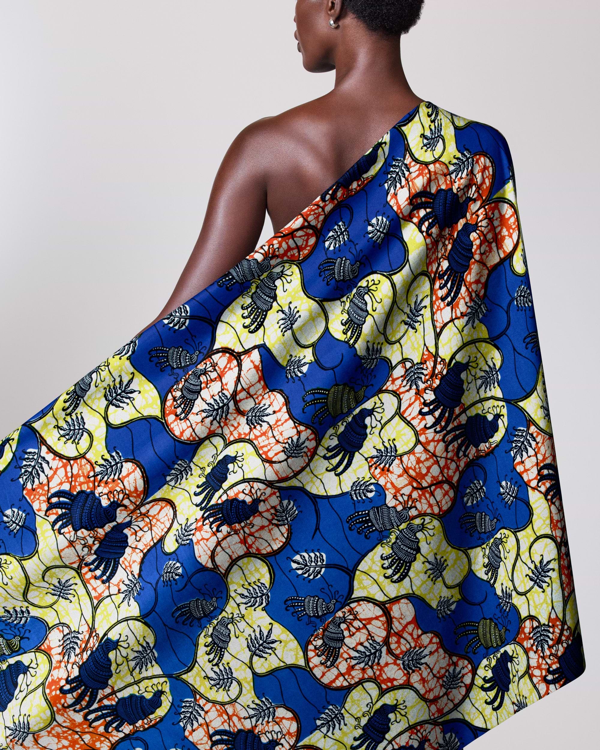 Colorful patterned fabric draped person’s super-wax vl02919.091