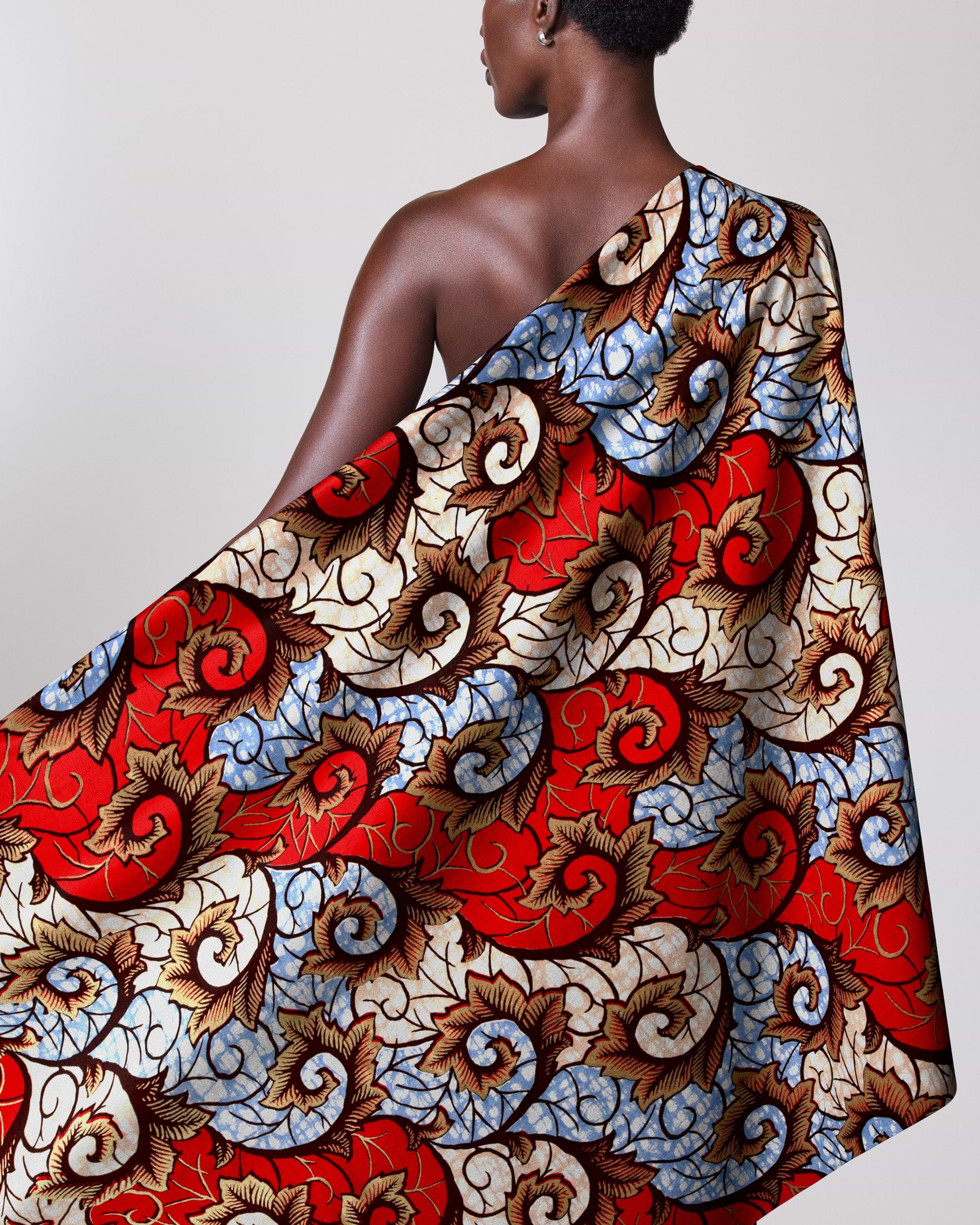 Woman draped colorful patterned fabric super-wax vl04860.023