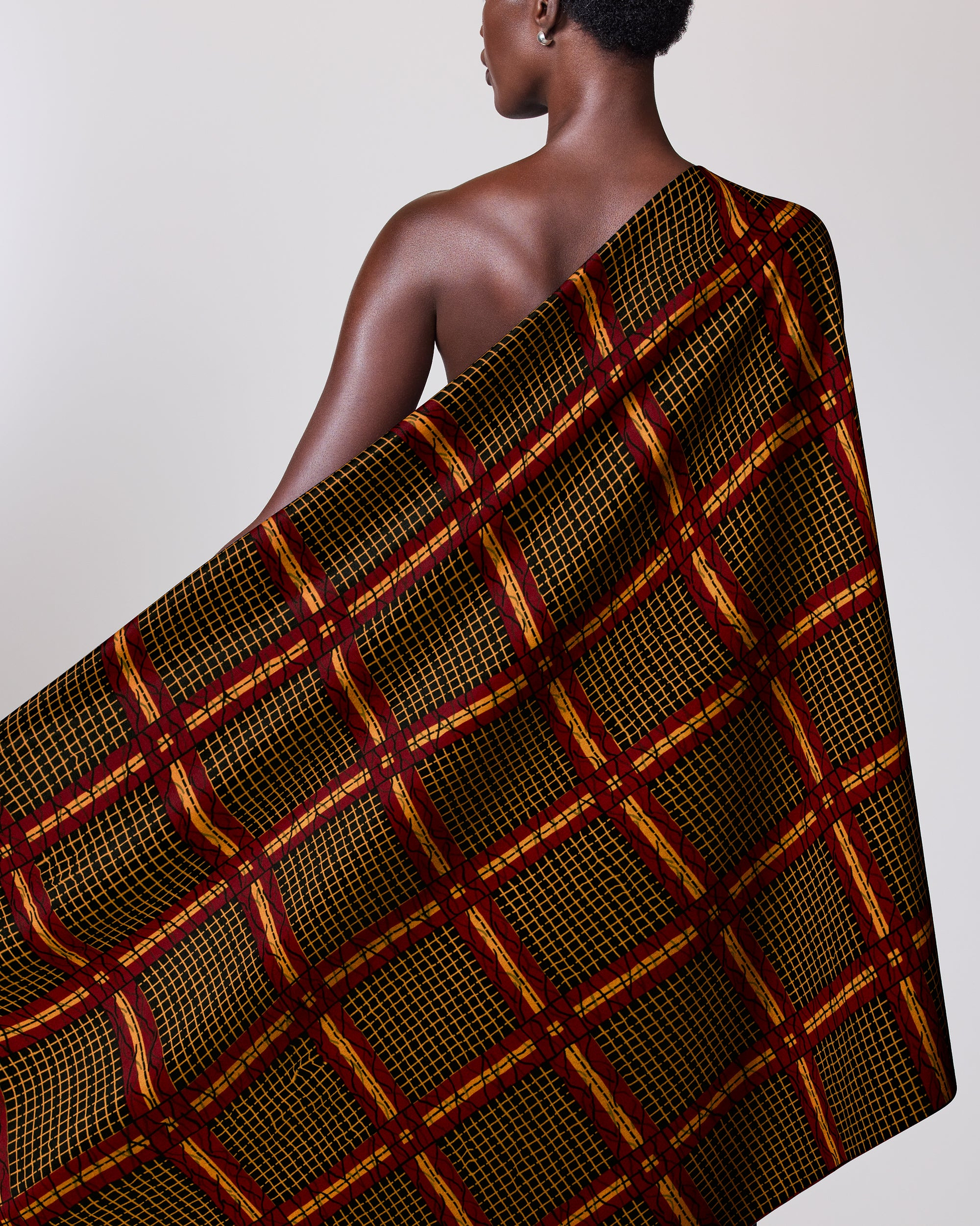 Dark-skinned woman draped patterned cloth wax hollandais vl49150.057