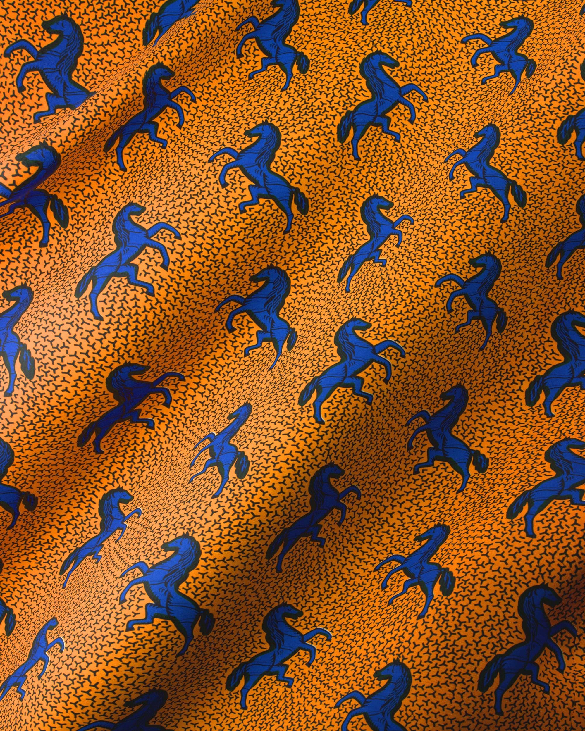 Orange fabric pattern blue horses wax hollandais vl53500.113