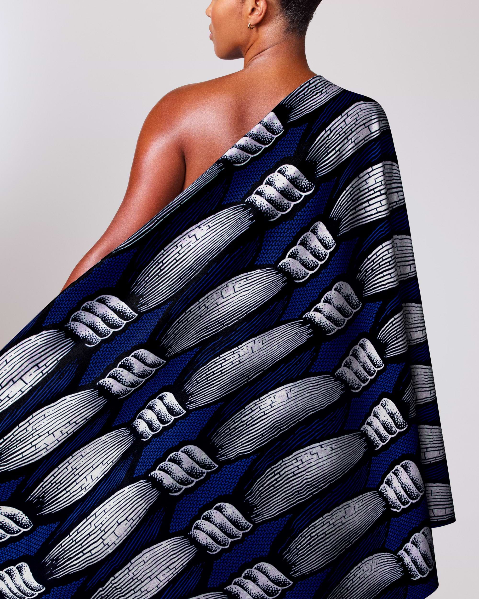 Woman wears navy blue one-shoulder wax hollandais vla0840.012