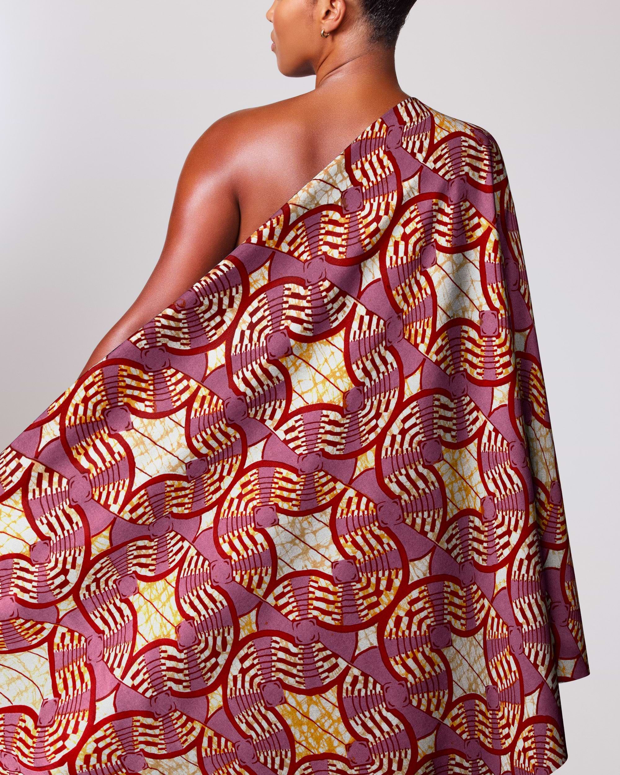 Woman wears one-shoulder dress made super-wax vls0476.008