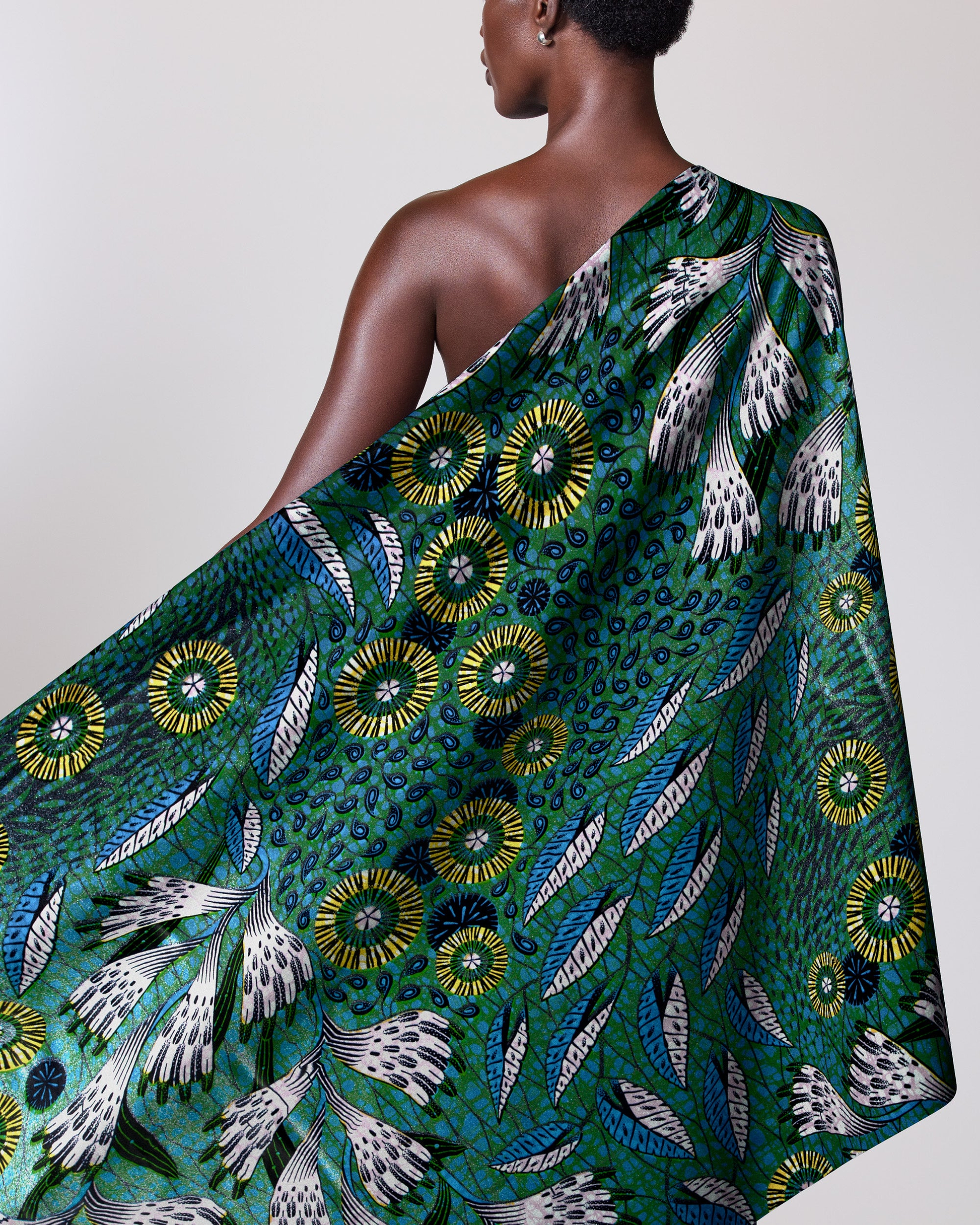 Green patterned fabric draped person grand super-wax vls1690.001