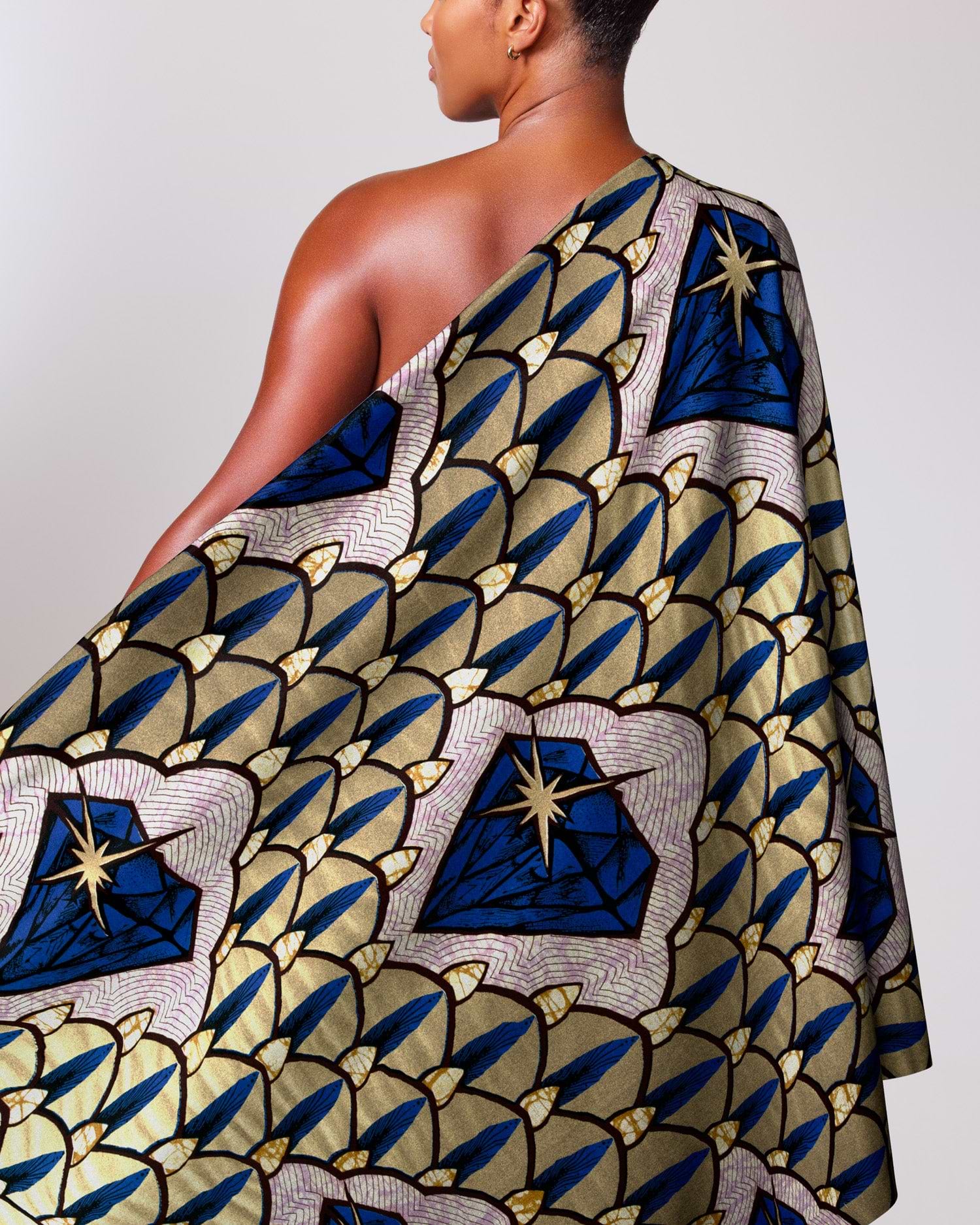 Woman wears one-shoulder wrap dress super-wax vls4rm0.029