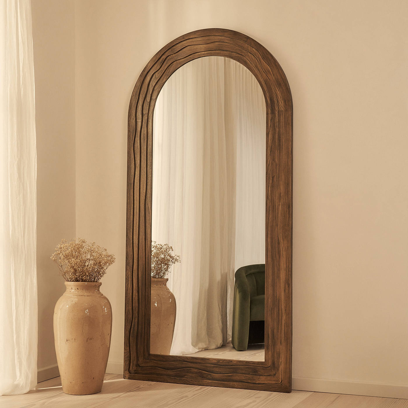 Full Length Arched mirror leaning against a wall