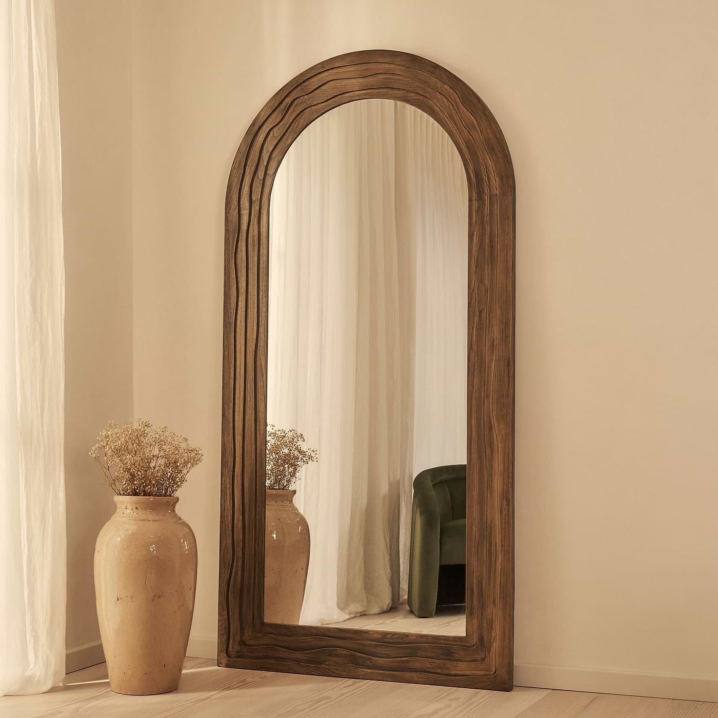 Full Length Arched mirror leaning against a wall