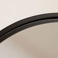 Full length arched black extra large metal mirror closeup
