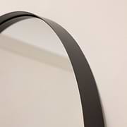 Full length arched black extra large metal mirror closeup