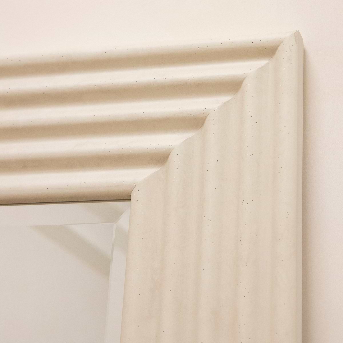 Full length ribbed concrete mirror closeup