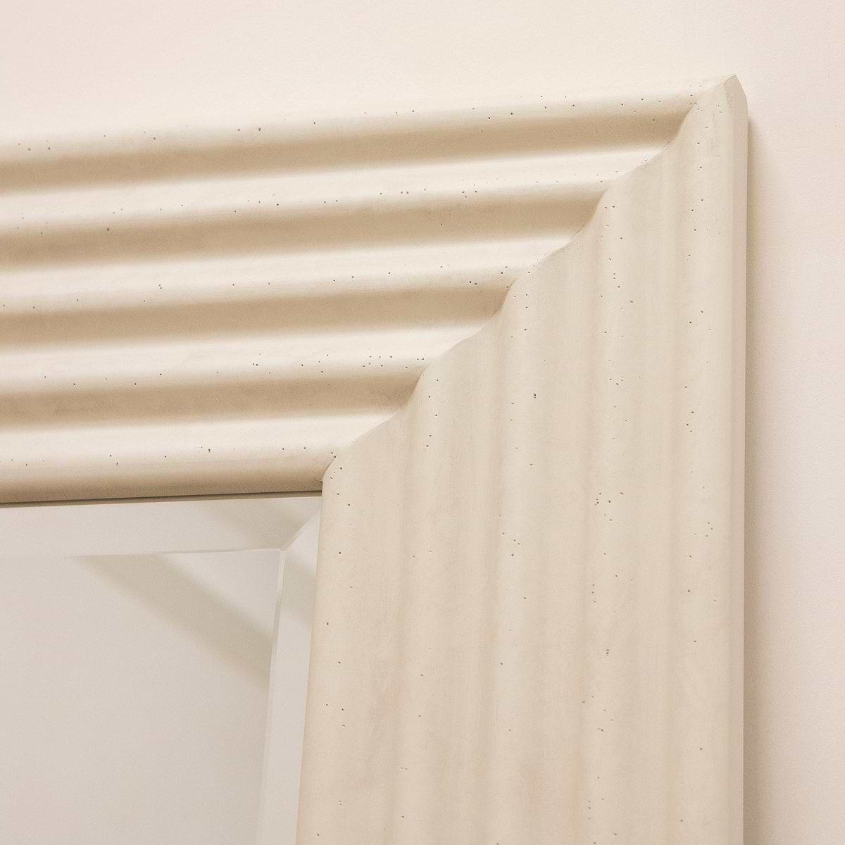 Full length ribbed concrete mirror closeup