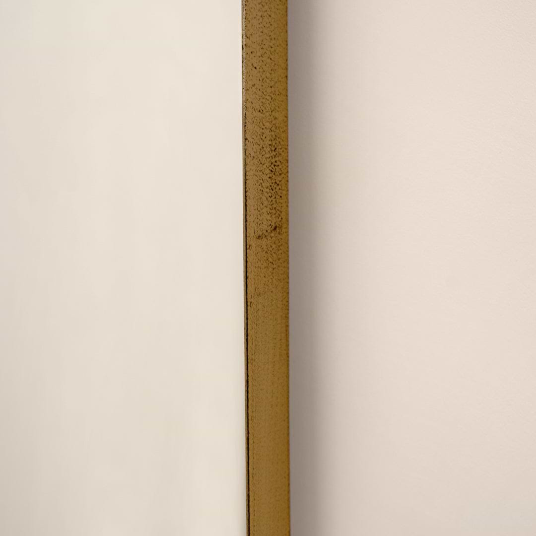 Closeup of Full length arched gold XXL vintage metal mirror