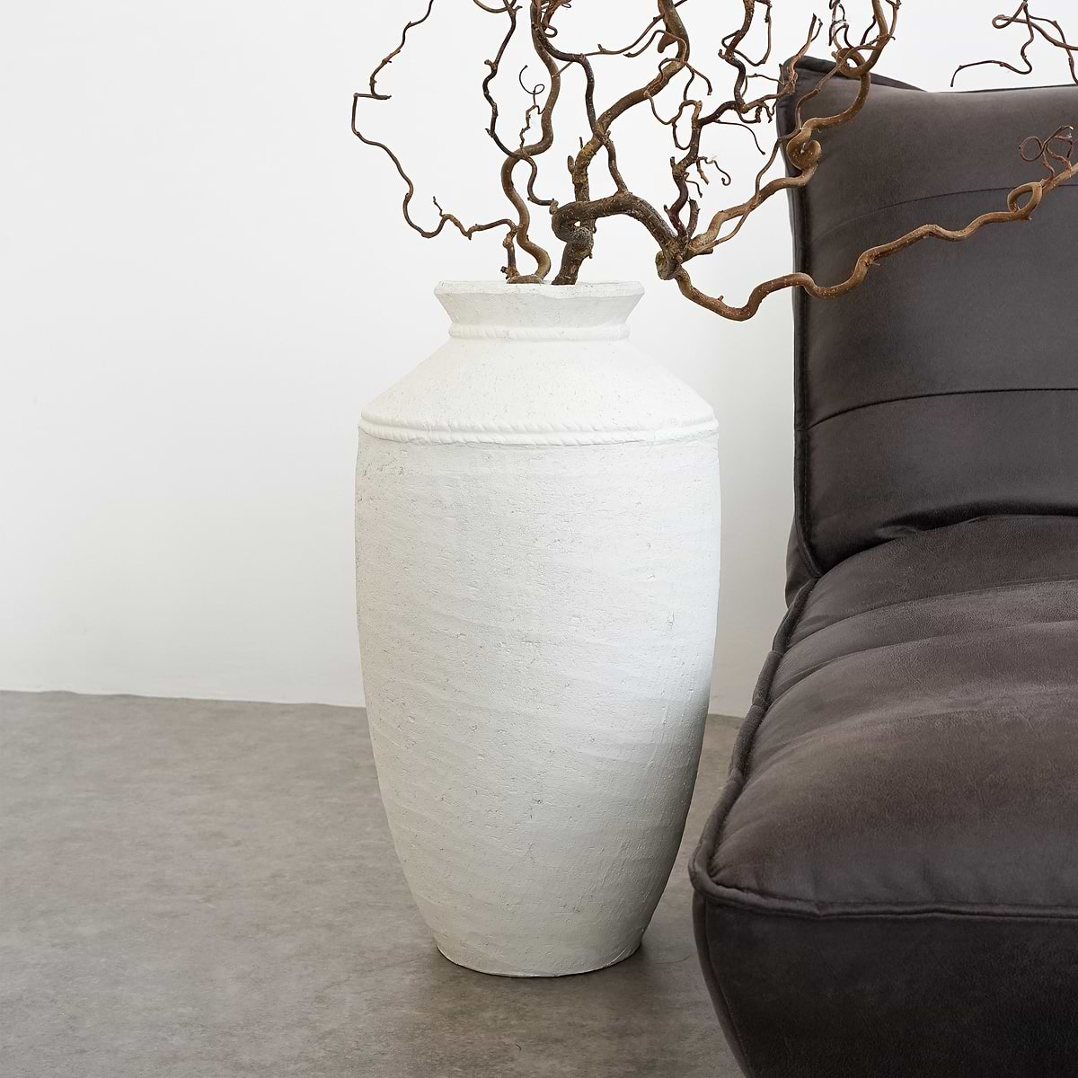 White Textured Terracotta Large Vase beside sofa
