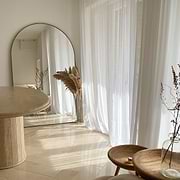 Gold Full Length Arched Metal Mirror in living room