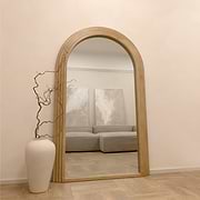 Full Length Arched Washed Wood Mirror in lounge opposite sofa