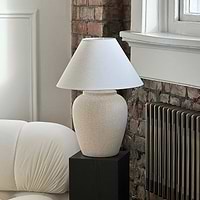 Stone Ceramic Coolie Shade Table Lamp on black pedestal